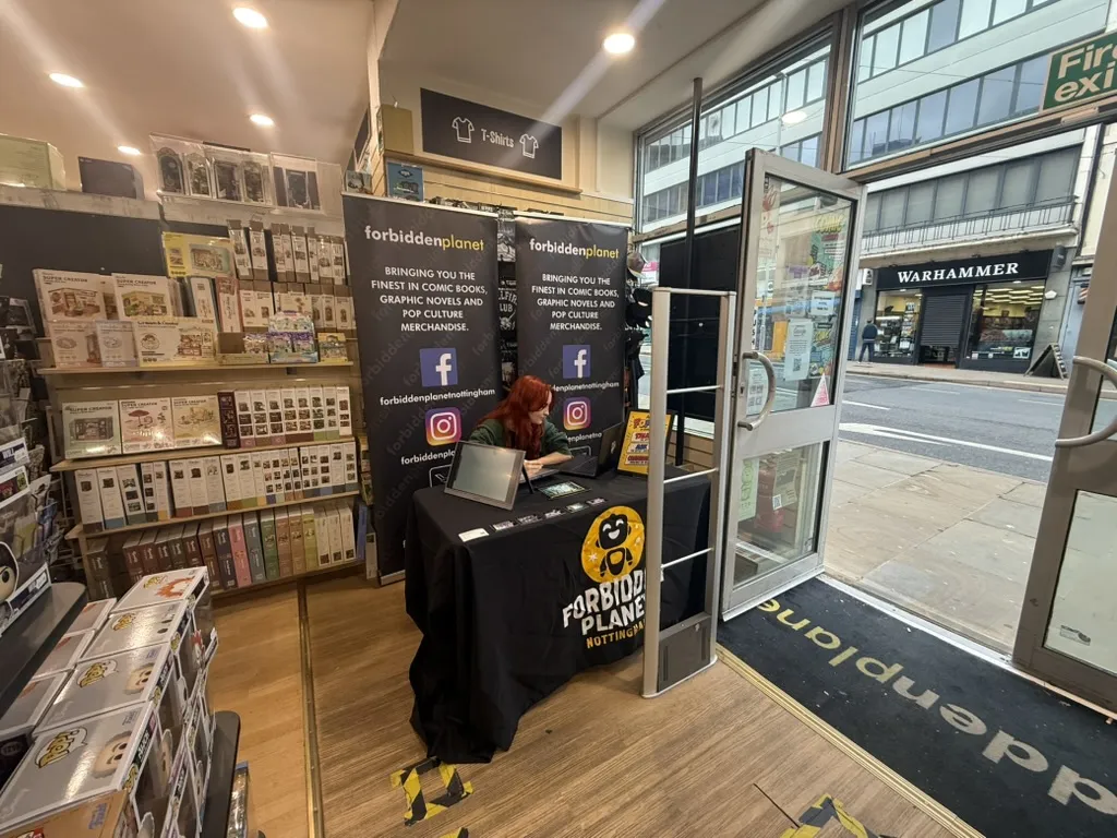 An artist's table set up just inside the door of Forbidden Planet in Nottingham